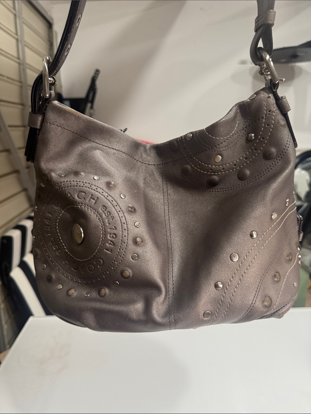 Coach Y2K Madison hobo bag featuring metallic pewter leather and silver studded